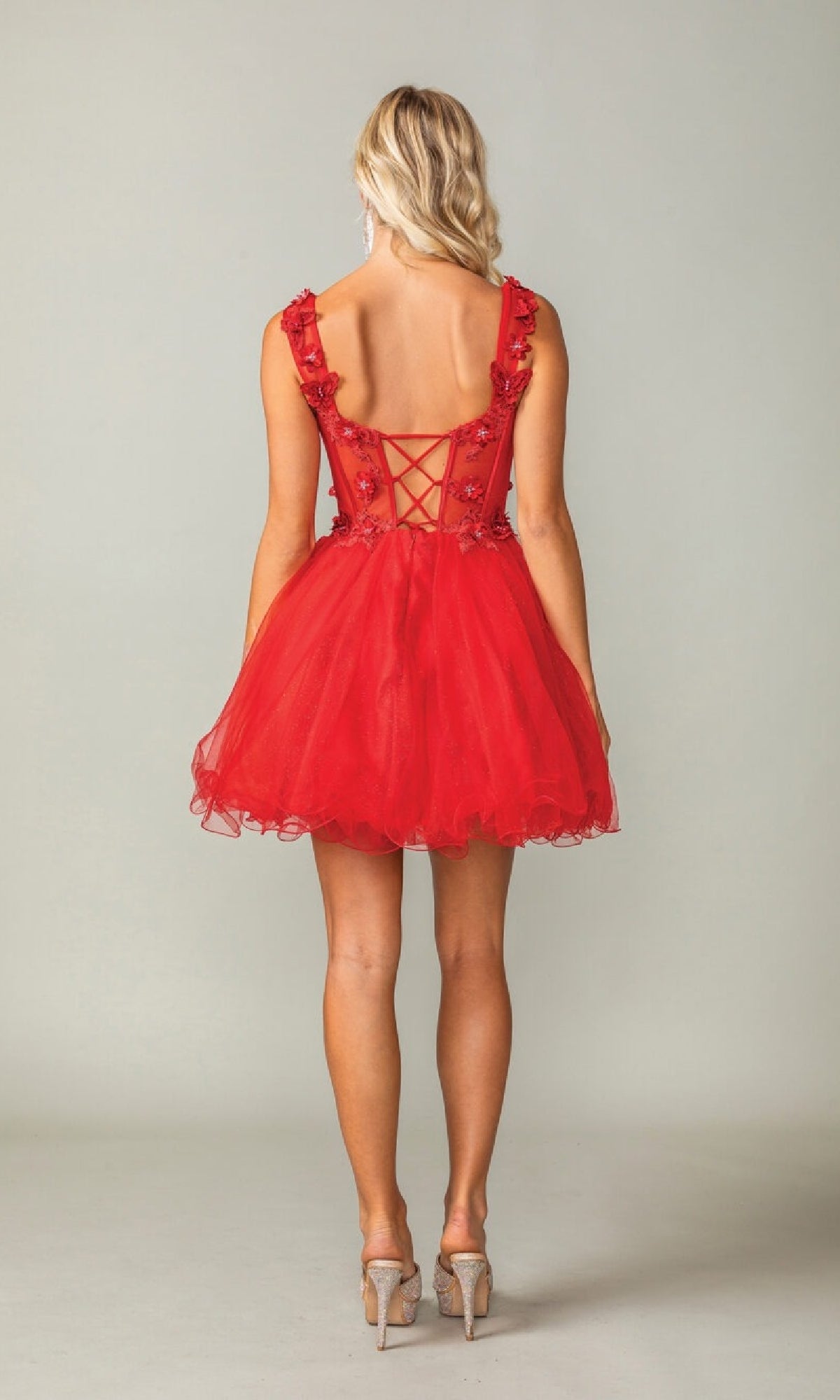 Red dress with lace details on a plain background